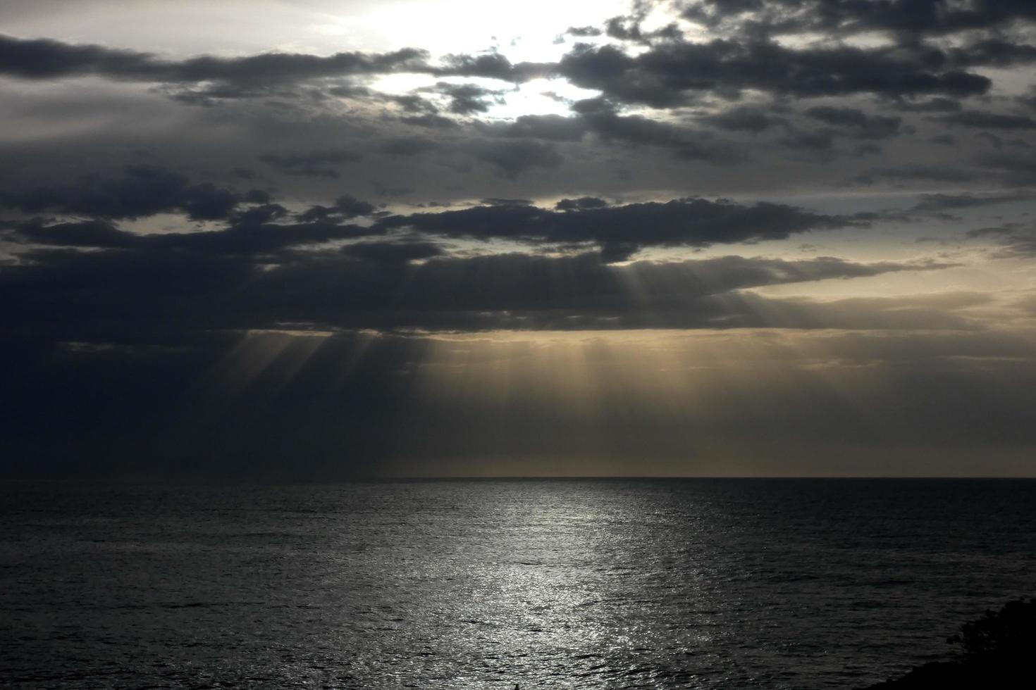 Clouds and light effects in the sky at dawn or dusk. photo