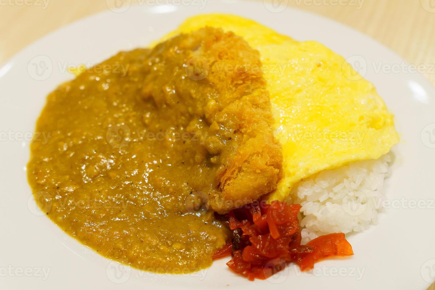 Japanese curry rice in close-up on white plate with blurred background photo