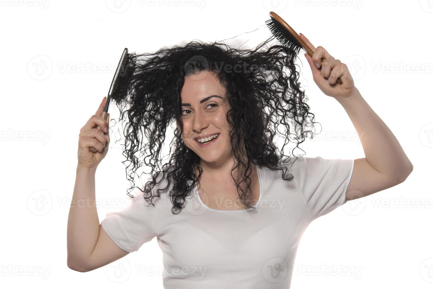 beautiful female with comb stuck in curly hair photo