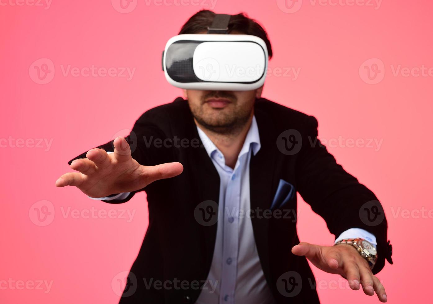 Arab Man experiencing virtual reality wearing virtual reality glasses photo