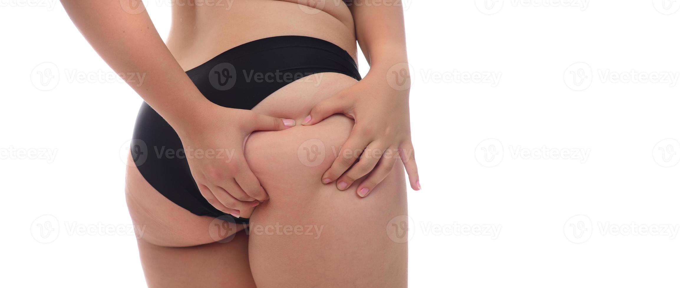 Oversize female pinching skin on her butt for test photo