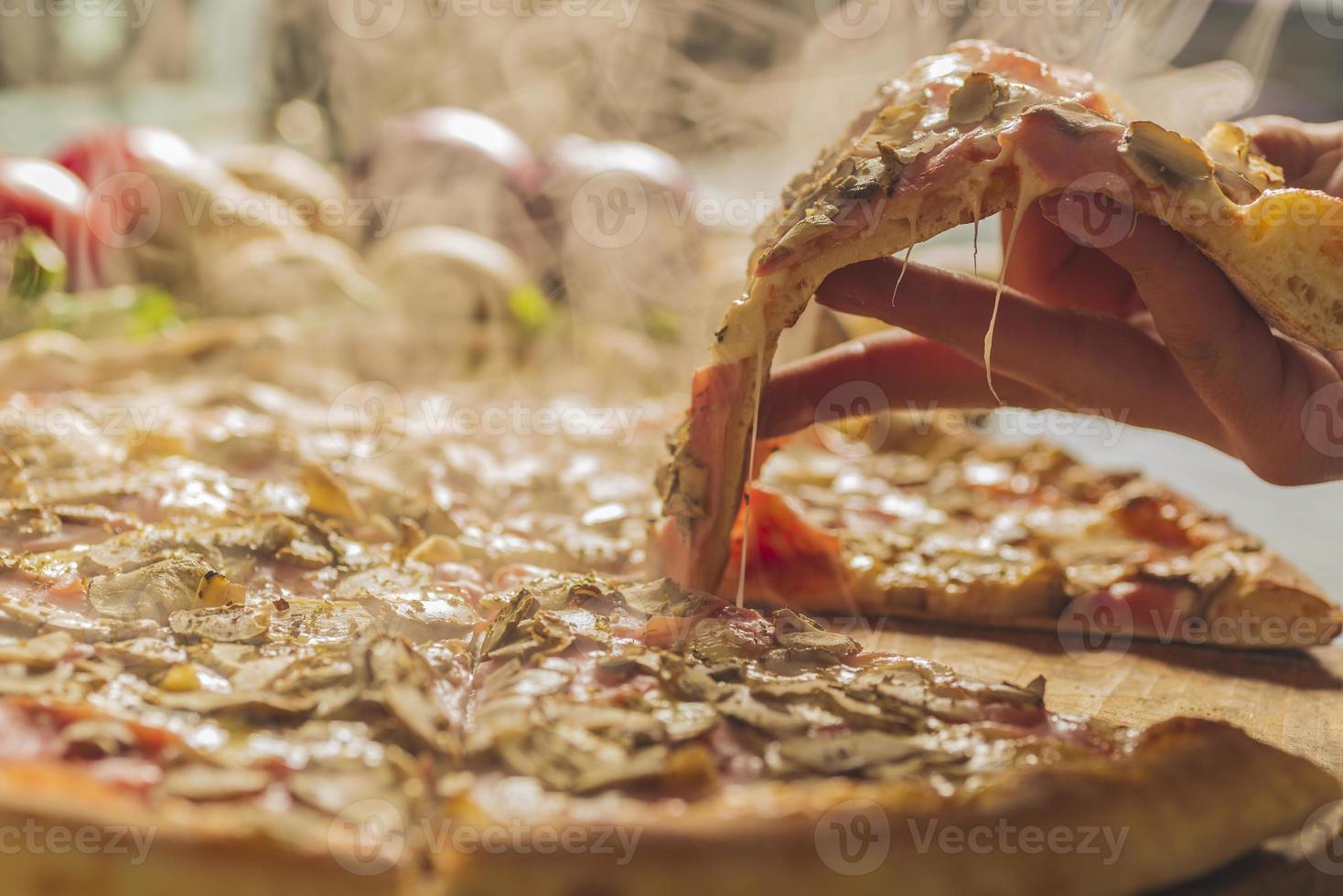 Fresh baked pizza with melted cheese photo