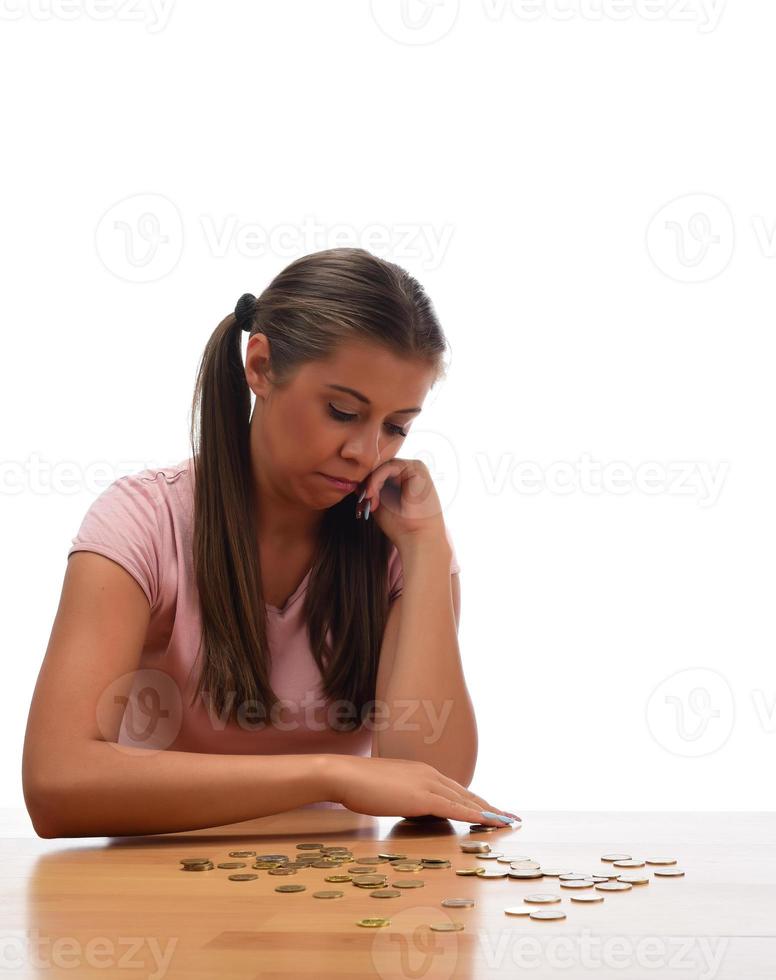 Young brunette women collecting metal money. savings finance concept photo