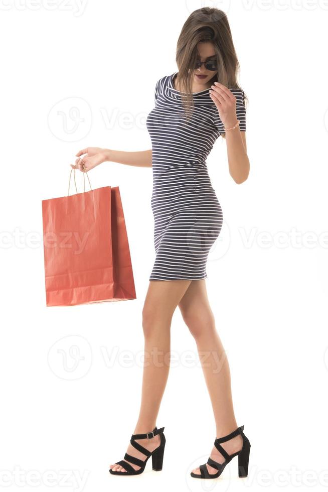 Young Modern Beautiful woman with a lot of shopping bags photo