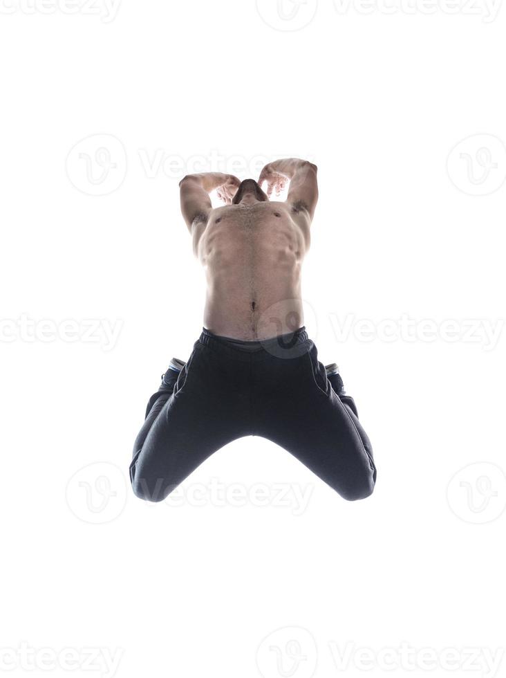 male model doing break dance routine. isolated on white background photo