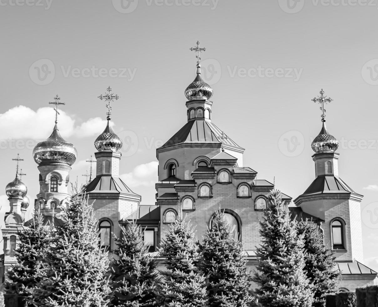 Christian church cross in high steeple tower for prayer photo