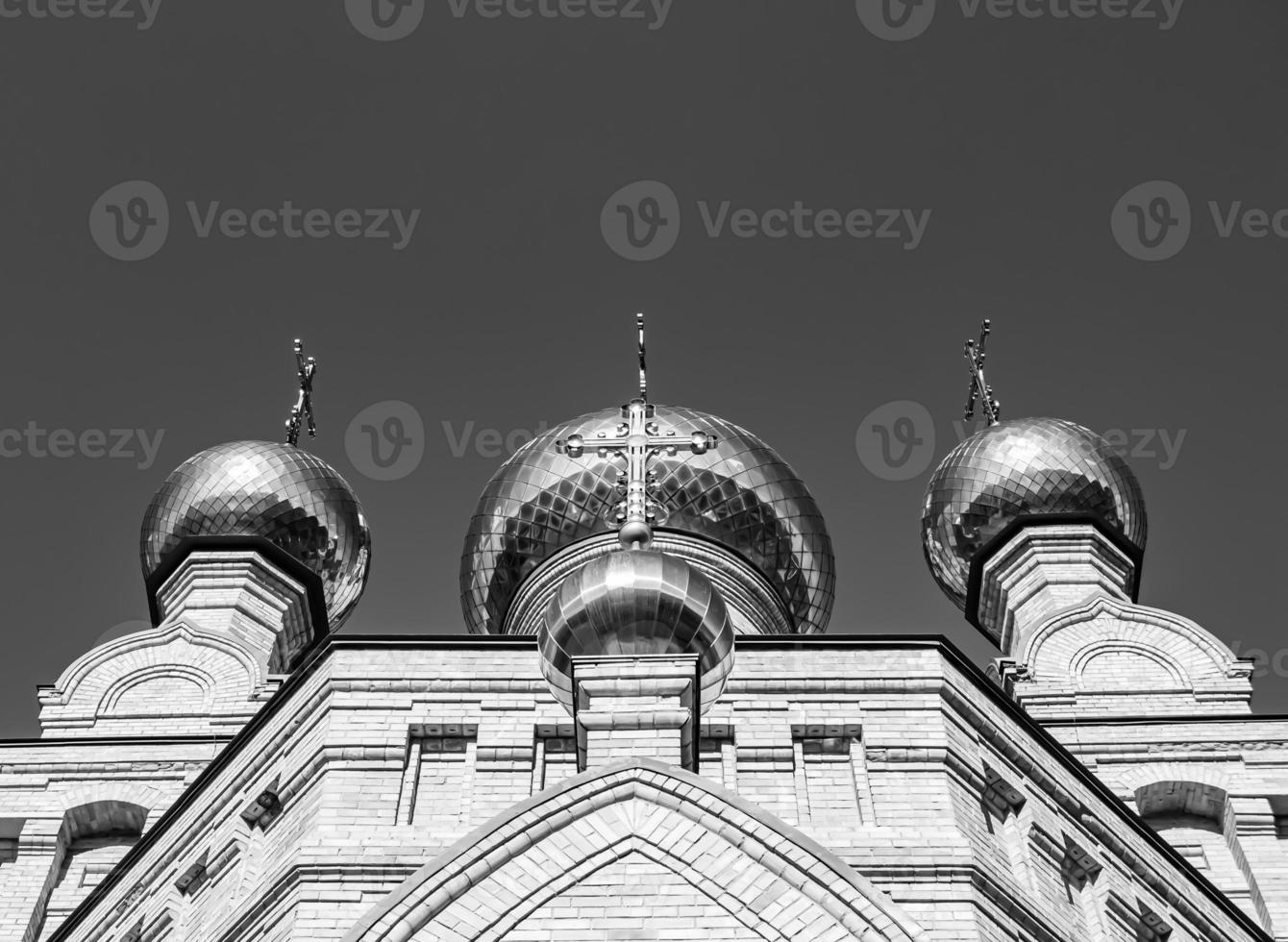 Christian church cross in high steeple tower for prayer photo