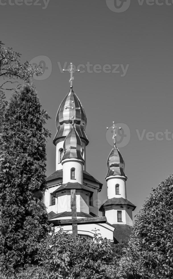 Christian church cross in high steeple tower for prayer photo