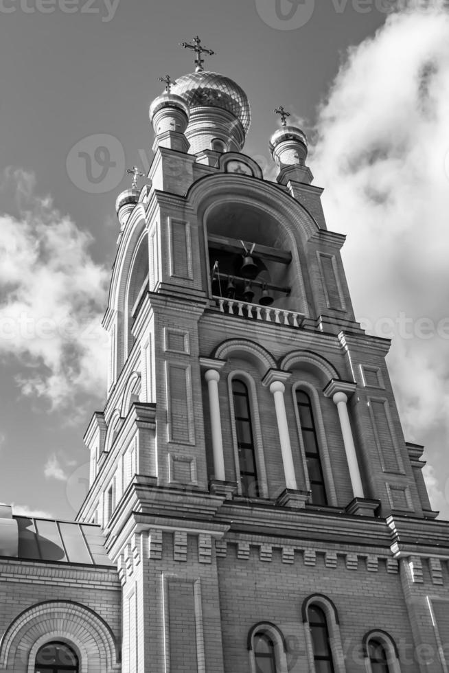 Christian church cross in high steeple tower for prayer photo