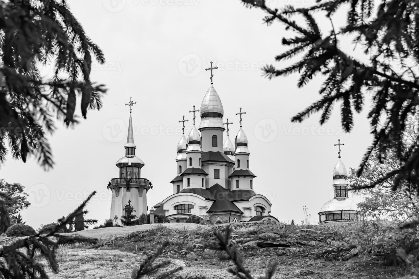 Christian church cross in high steeple tower for prayer photo