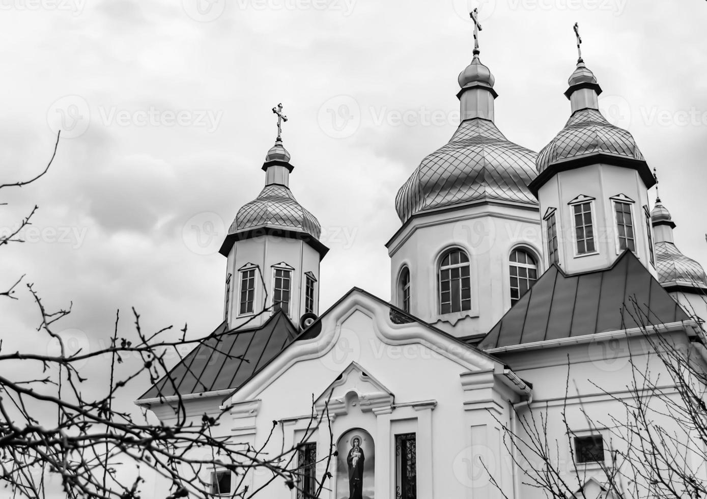 Christian church cross in high steeple tower for prayer photo