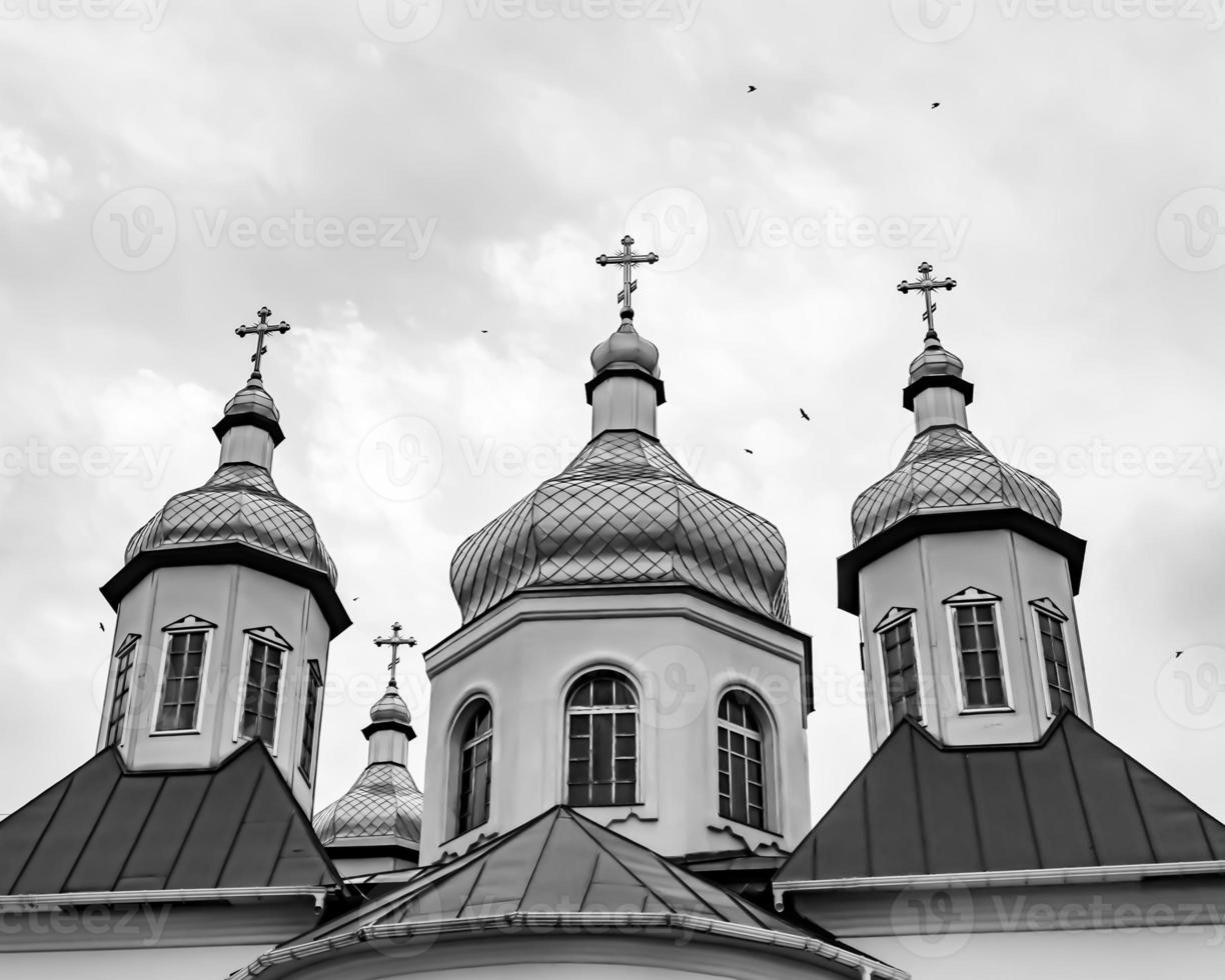 Christian church cross in high steeple tower for prayer photo