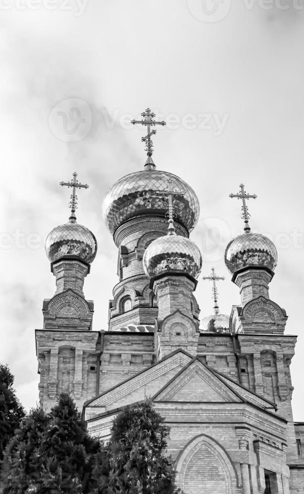 Christian church cross in high steeple tower for prayer photo