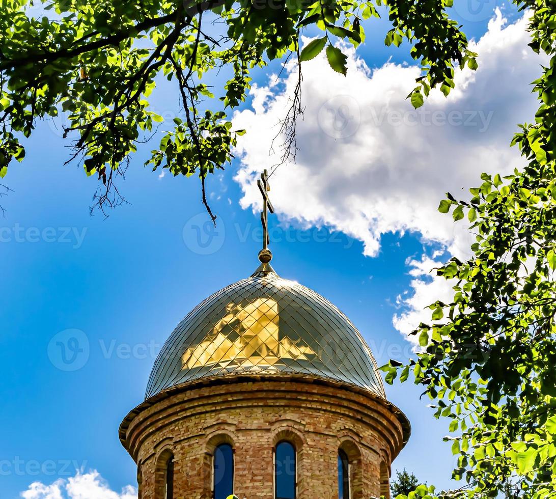 Christian church cross in high steeple tower for prayer photo