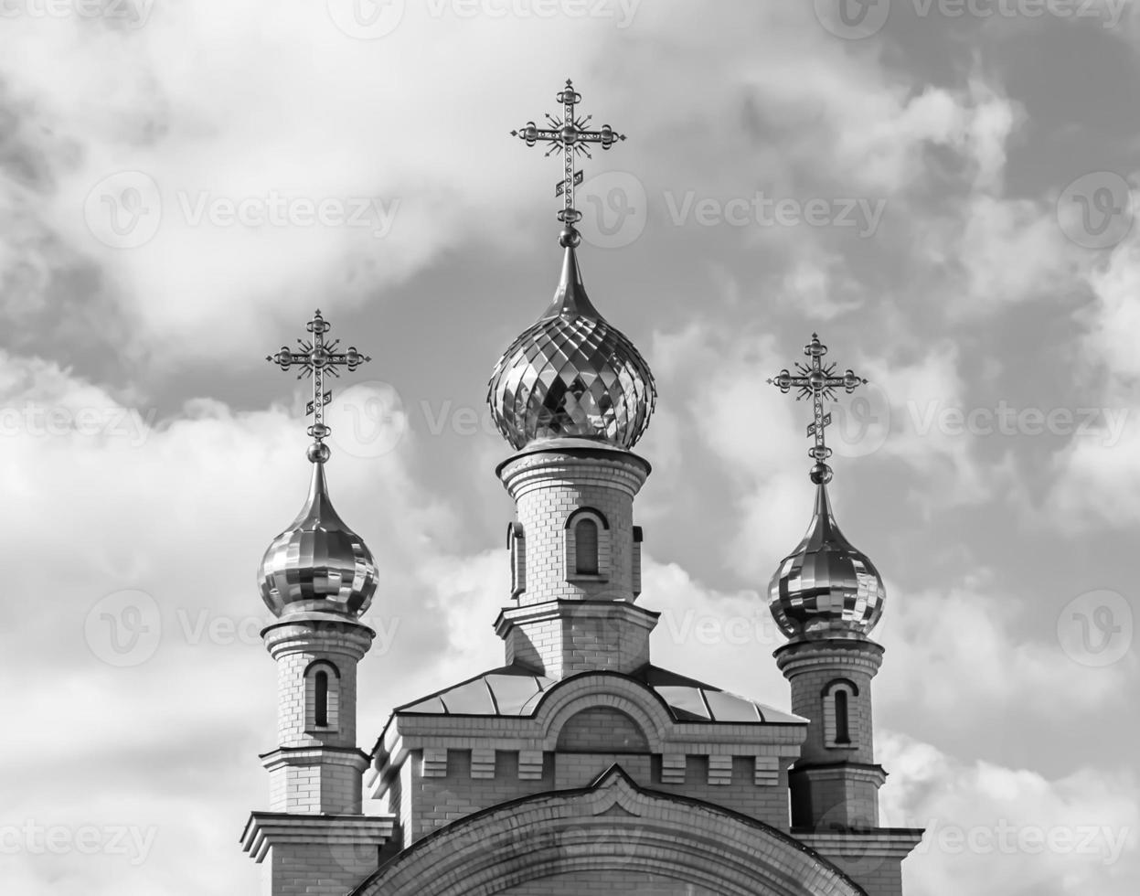 Christian church cross in high steeple tower for prayer photo