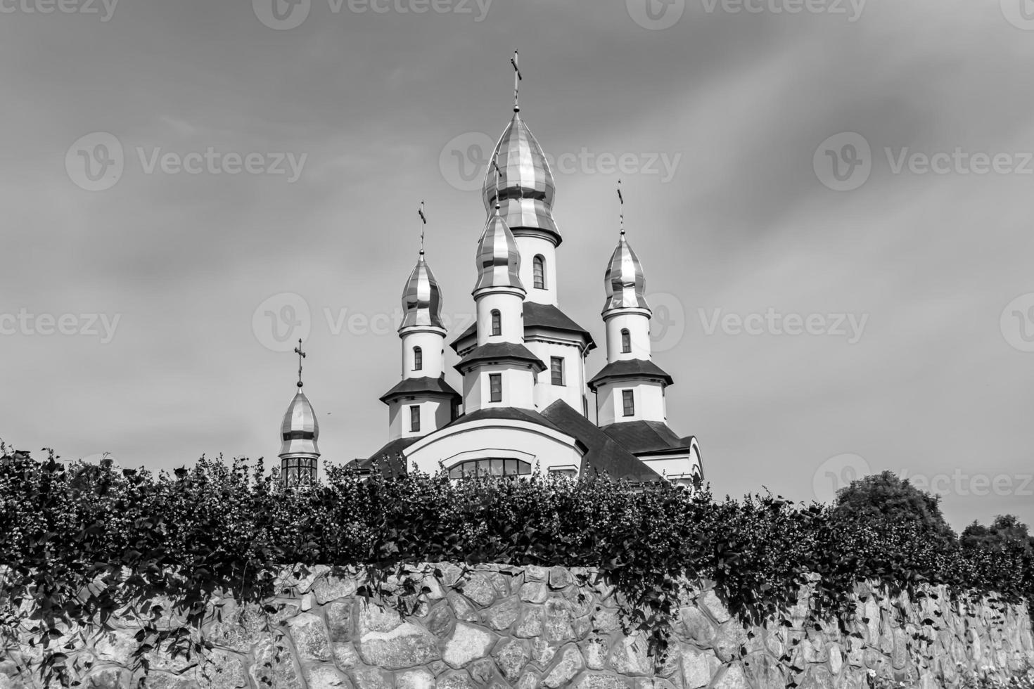 Christian church cross in high steeple tower for prayer photo