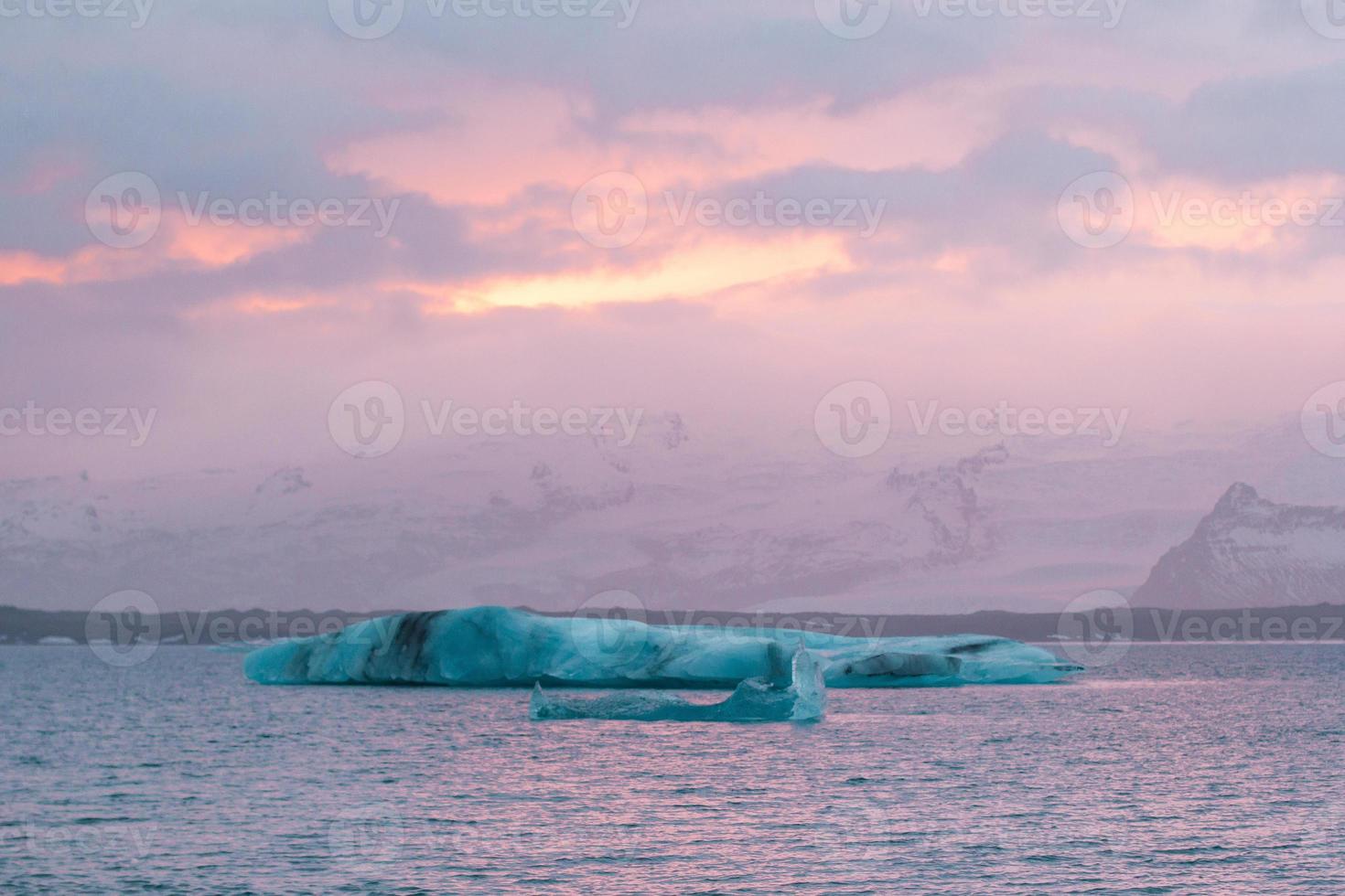 Icebergs against snowy mountains landscape photo