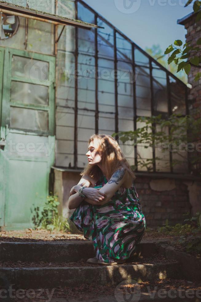 Absorbed in thought lady waiting on doorstep scenic photography photo