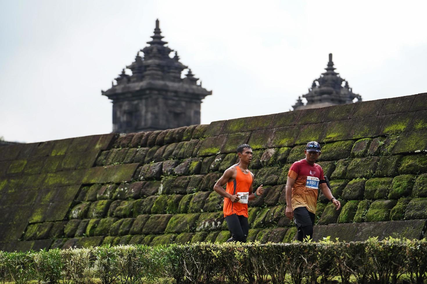 Yogyakarta, Indonesia - November 20, 2022 The Sleman Temple Run contingent passed the scenic route of the Barong temple, they took part in a trail running contest. photo