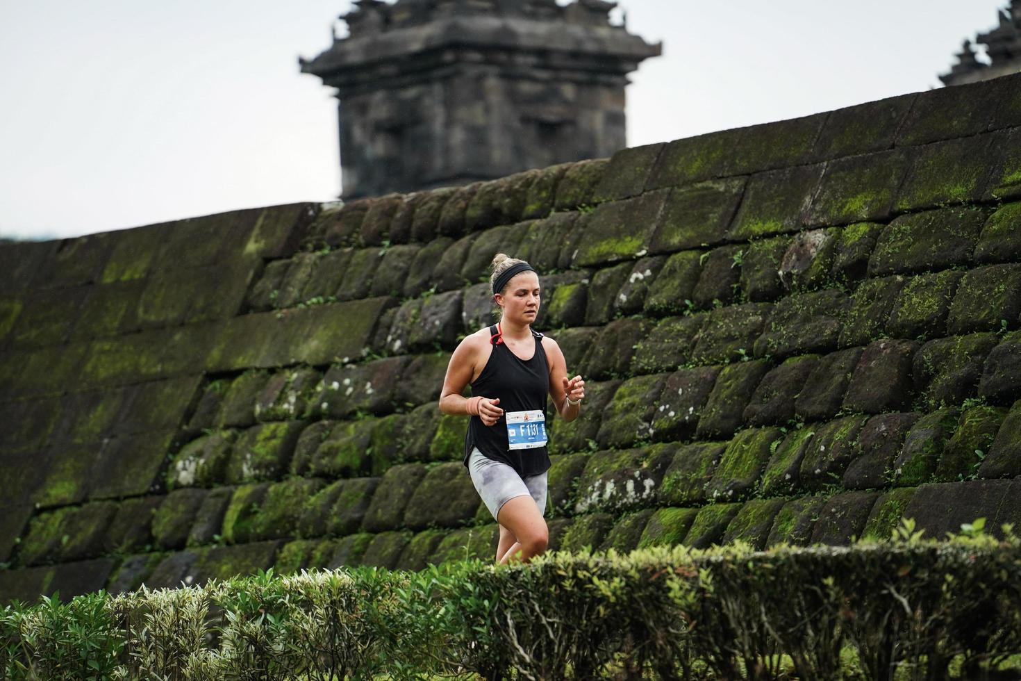 Yogyakarta, Indonesia - November 20, 2022 The Sleman Temple Run contingent passed the scenic route of the Barong temple, they took part in a trail running contest. photo