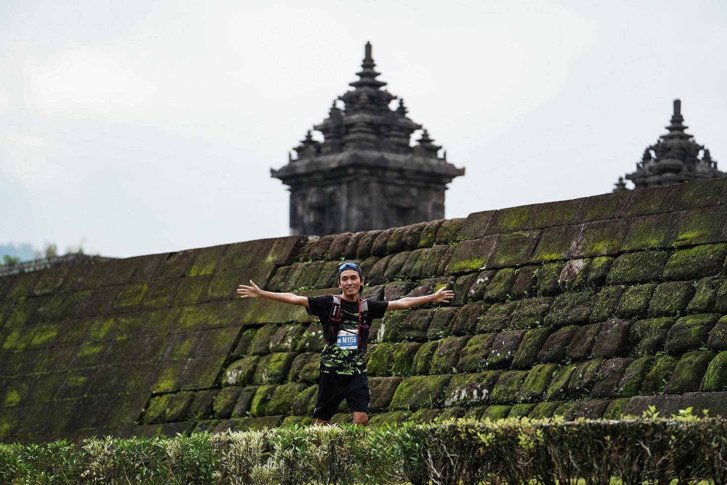 Yogyakarta, Indonesia - November 20, 2022 The Sleman Temple Run contingent passed the scenic route of the Barong temple, they took part in a trail running contest. photo