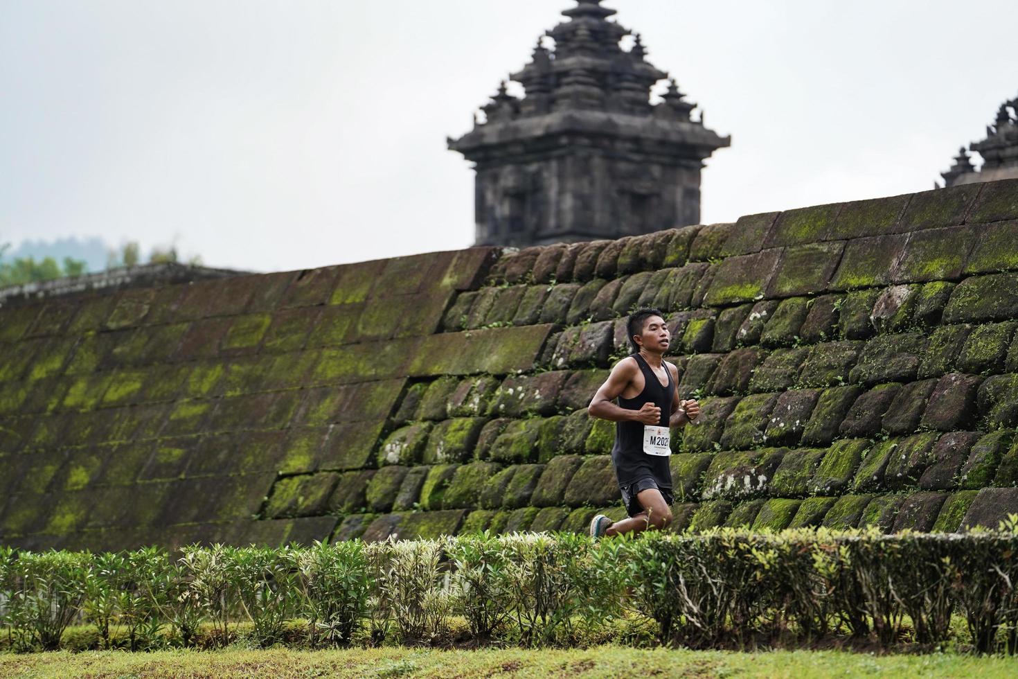 Yogyakarta, Indonesia - November 20, 2022 The Sleman Temple Run contingent passed the scenic route of the Barong temple, they took part in a trail running contest. photo