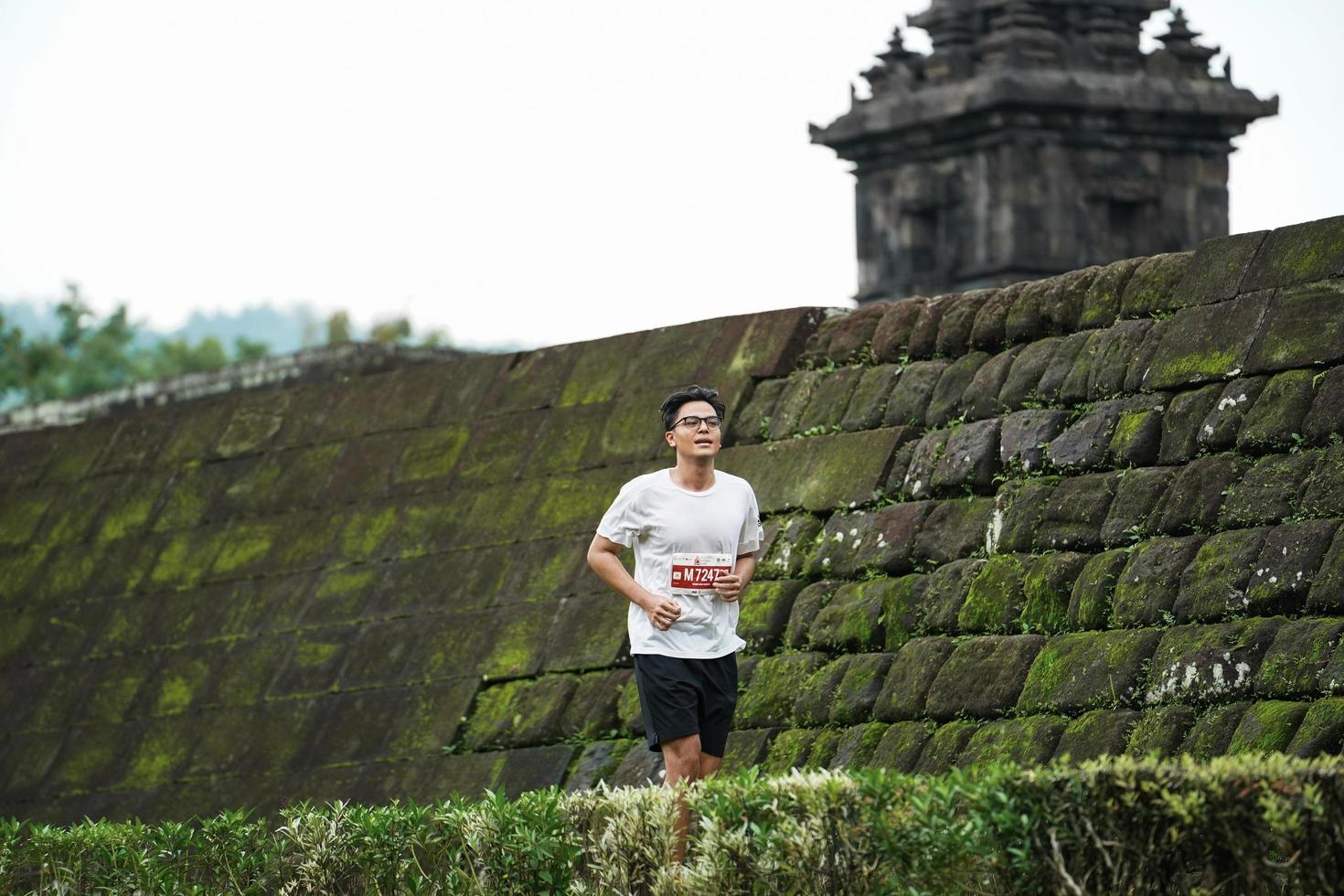 Yogyakarta, Indonesia - November 20, 2022 The Sleman Temple Run contingent passed the scenic route of the Barong temple, they took part in a trail running contest. photo