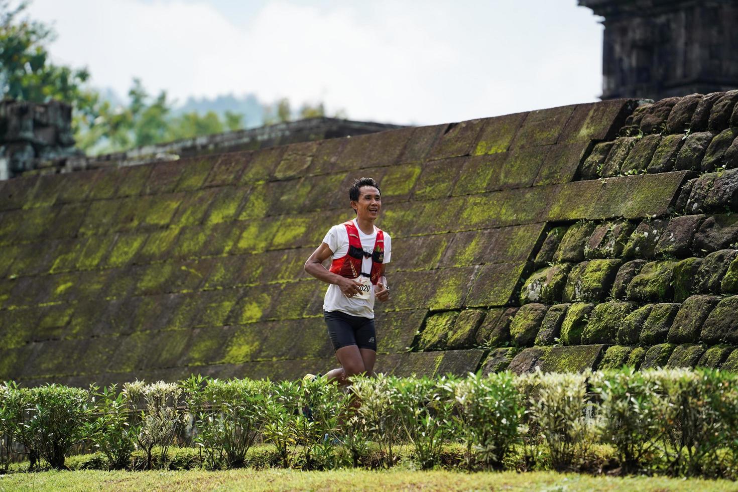 Yogyakarta, Indonesia - November 20, 2022 The Sleman Temple Run contingent passed the scenic route of the Barong temple, they took part in a trail running contest. photo