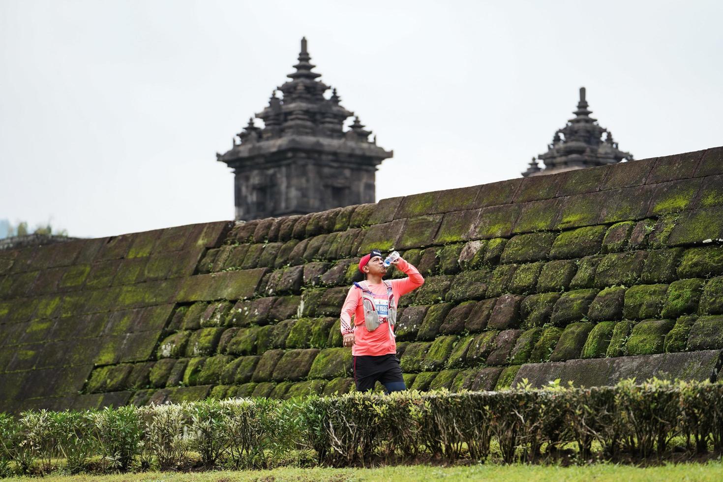 Yogyakarta, Indonesia - November 20, 2022 The Sleman Temple Run contingent passed the scenic route of the Barong temple, they took part in a trail running contest. photo