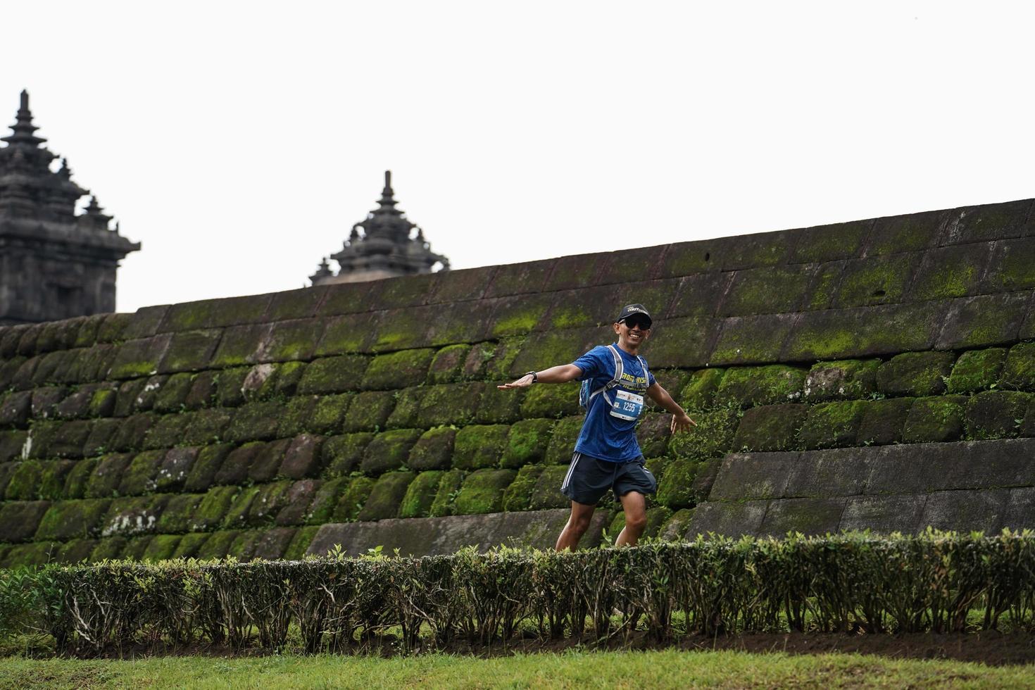 Yogyakarta, Indonesia - November 20, 2022 The Sleman Temple Run contingent passed the scenic route of the Barong temple, they took part in a trail running contest. photo