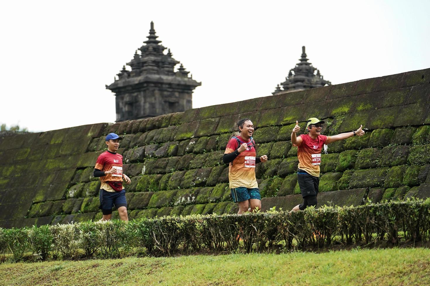 Yogyakarta, Indonesia - November 20, 2022 The Sleman Temple Run contingent passed the scenic route of the Barong temple, they took part in a trail running contest. photo
