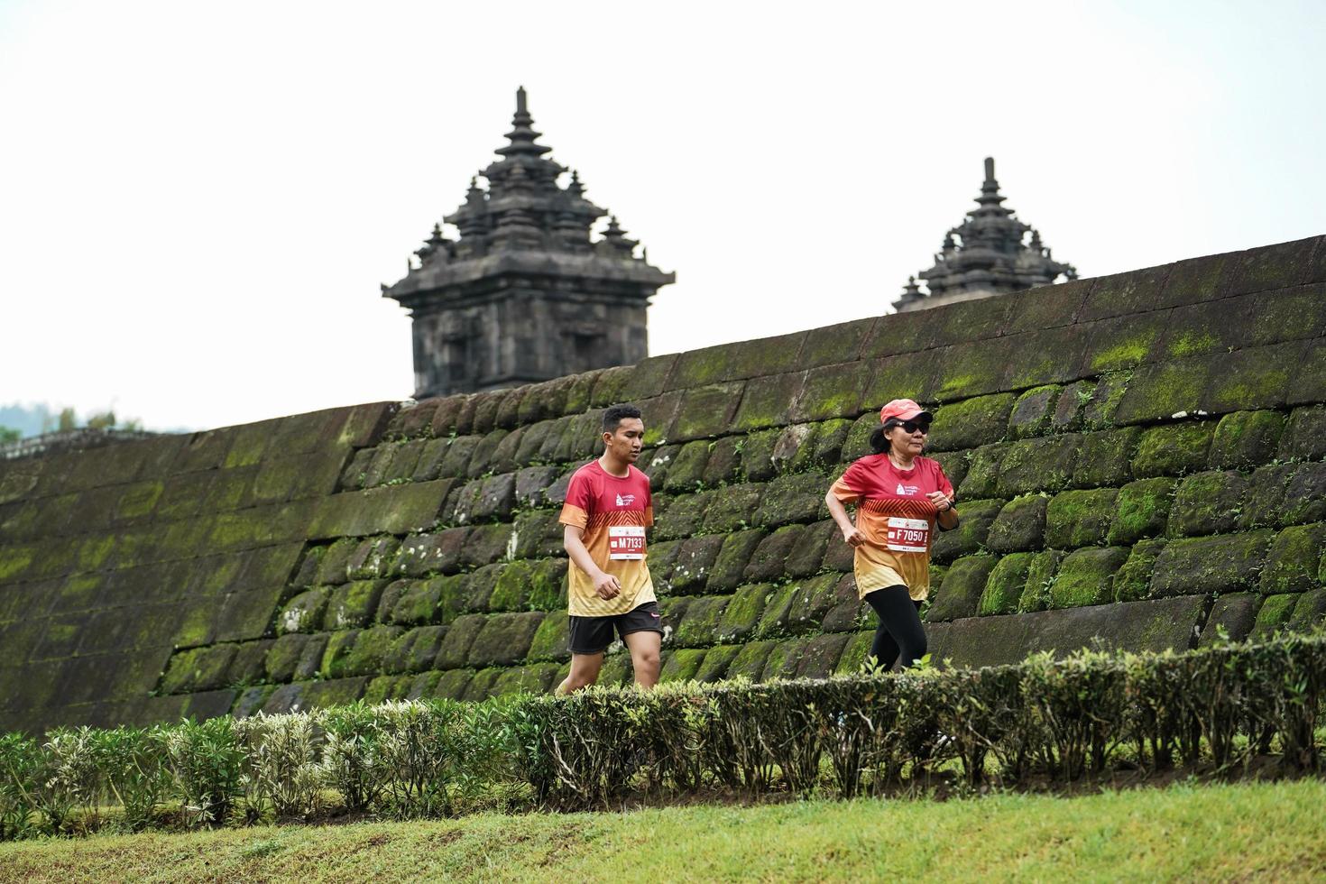 Yogyakarta, Indonesia - November 20, 2022 The Sleman Temple Run contingent passed the scenic route of the Barong temple, they took part in a trail running contest. photo