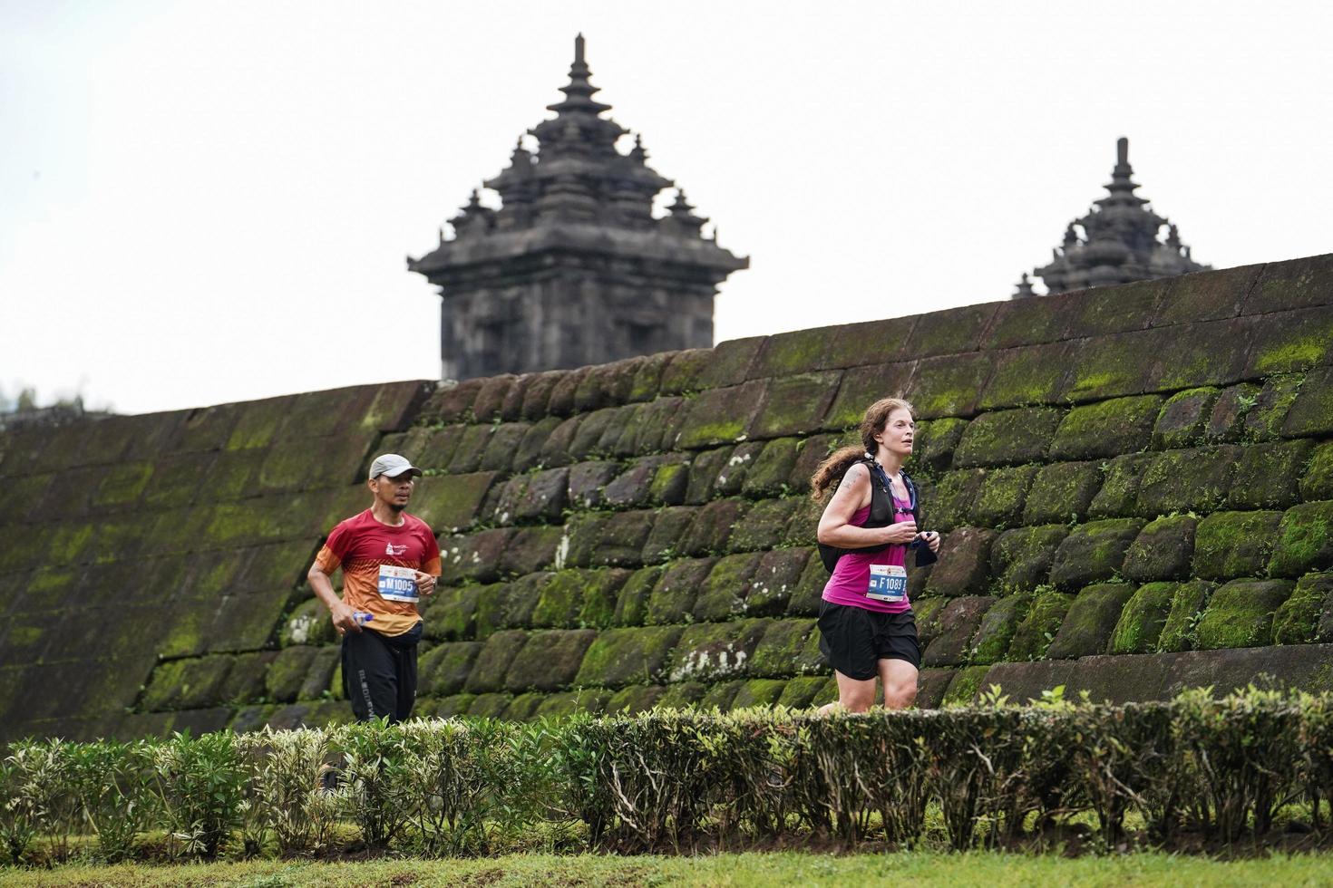 Yogyakarta, Indonesia - November 20, 2022 The Sleman Temple Run contingent passed the scenic route of the Barong temple, they took part in a trail running contest. photo
