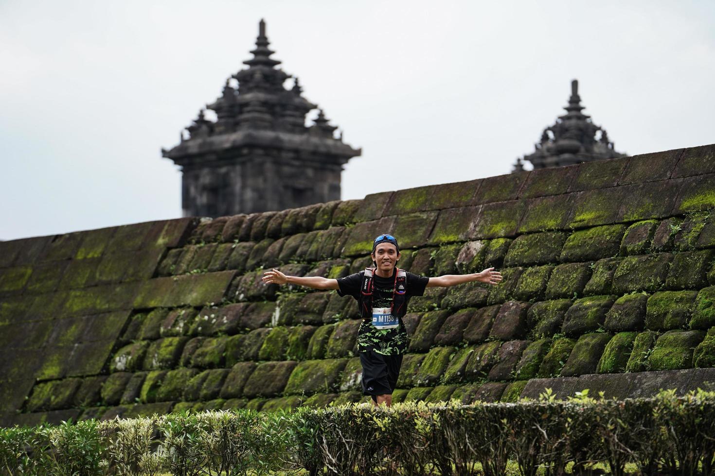 Yogyakarta, Indonesia - November 20, 2022 The Sleman Temple Run contingent passed the scenic route of the Barong temple, they took part in a trail running contest. photo