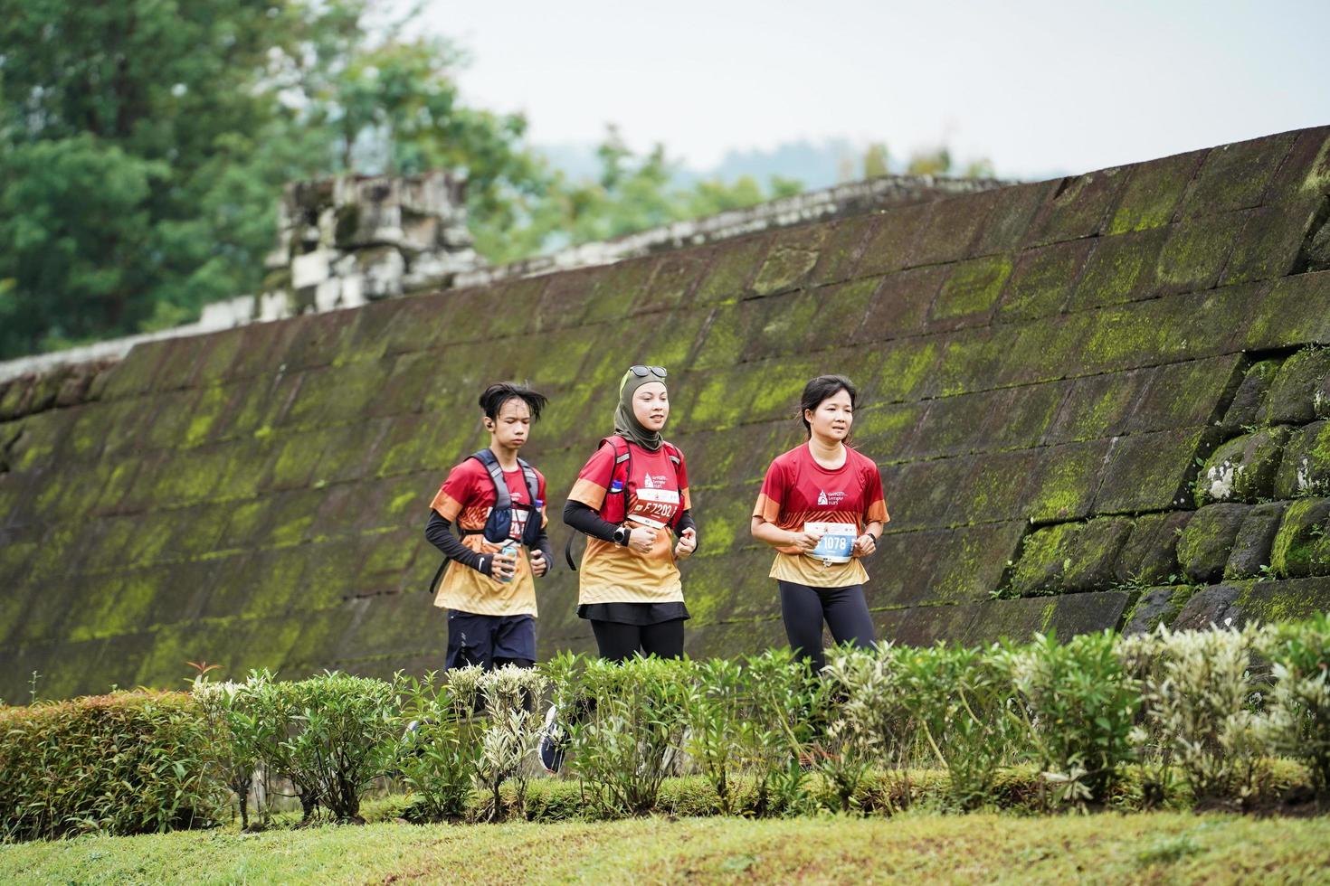 Yogyakarta, Indonesia - November 20, 2022 The Sleman Temple Run contingent passed the scenic route of the Barong temple, they took part in a trail running contest. photo