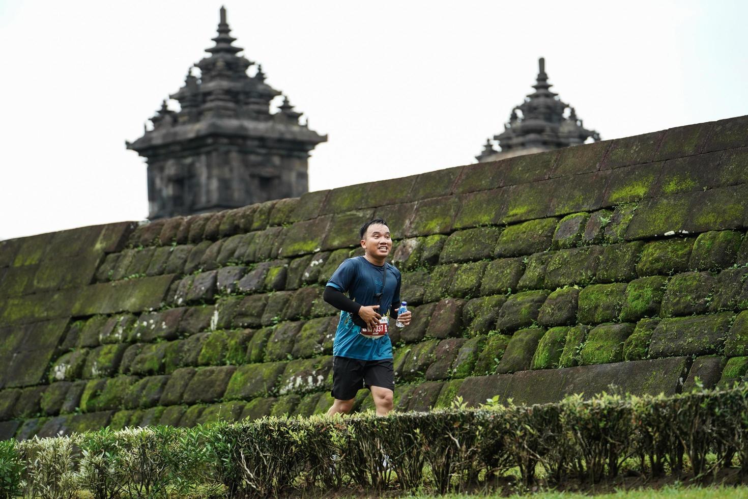 Yogyakarta, Indonesia - November 20, 2022 The Sleman Temple Run contingent passed the scenic route of the Barong temple, they took part in a trail running contest. photo