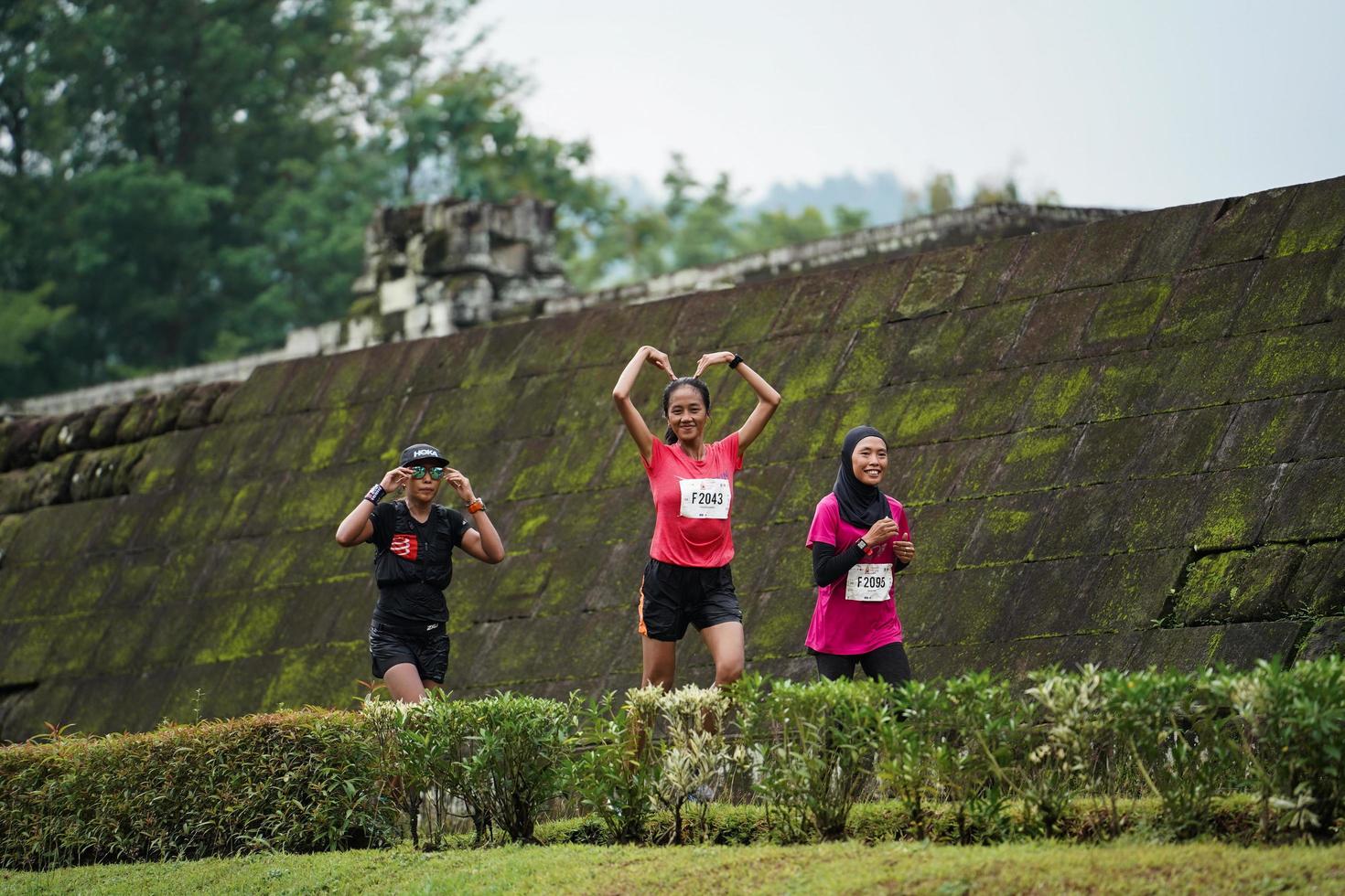 Yogyakarta, Indonesia - November 20, 2022 The Sleman Temple Run contingent passed the scenic route of the Barong temple, they took part in a trail running contest. photo