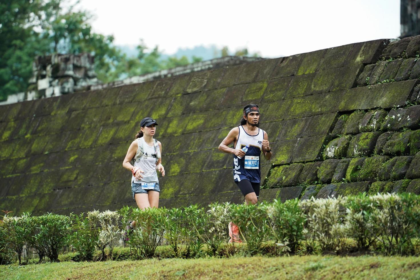 Yogyakarta, Indonesia - November 20, 2022 The Sleman Temple Run contingent passed the scenic route of the Barong temple, they took part in a trail running contest. photo
