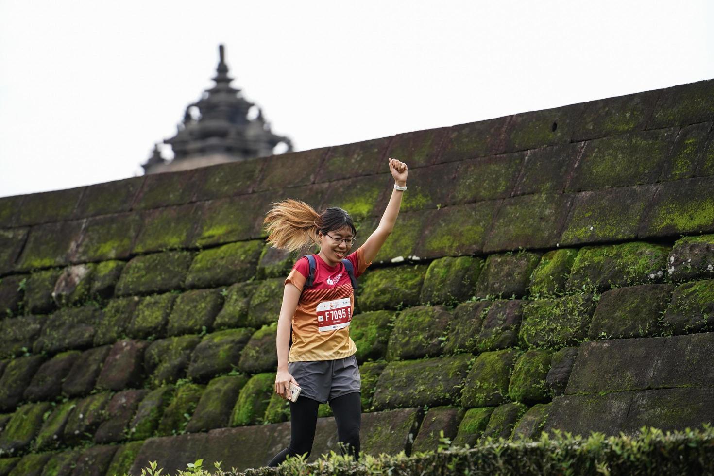 Yogyakarta, Indonesia - November 20, 2022 The Sleman Temple Run contingent passed the scenic route of the Barong temple, they took part in a trail running contest. photo