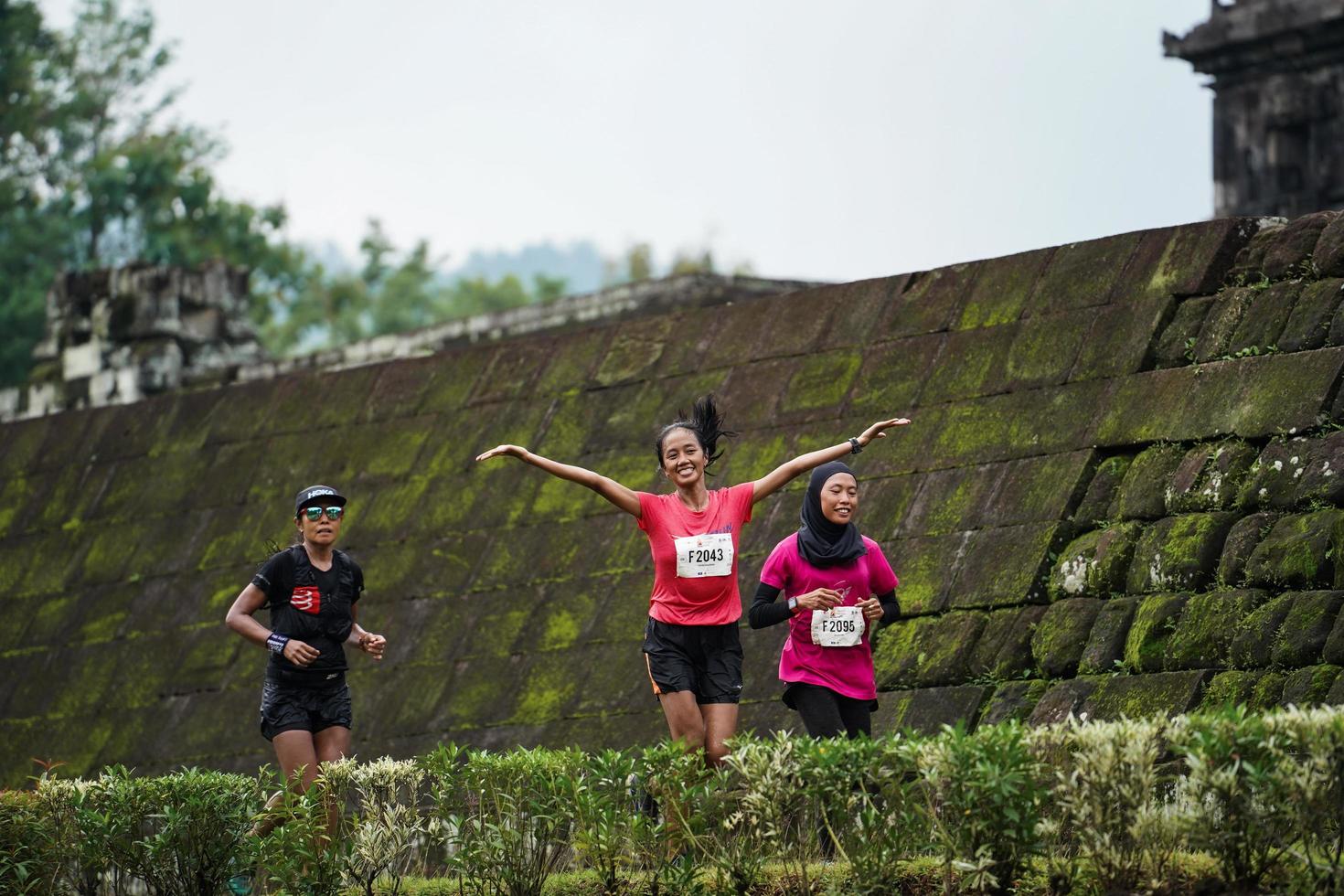Yogyakarta, Indonesia - November 20, 2022 The Sleman Temple Run contingent passed the scenic route of the Barong temple, they took part in a trail running contest. photo