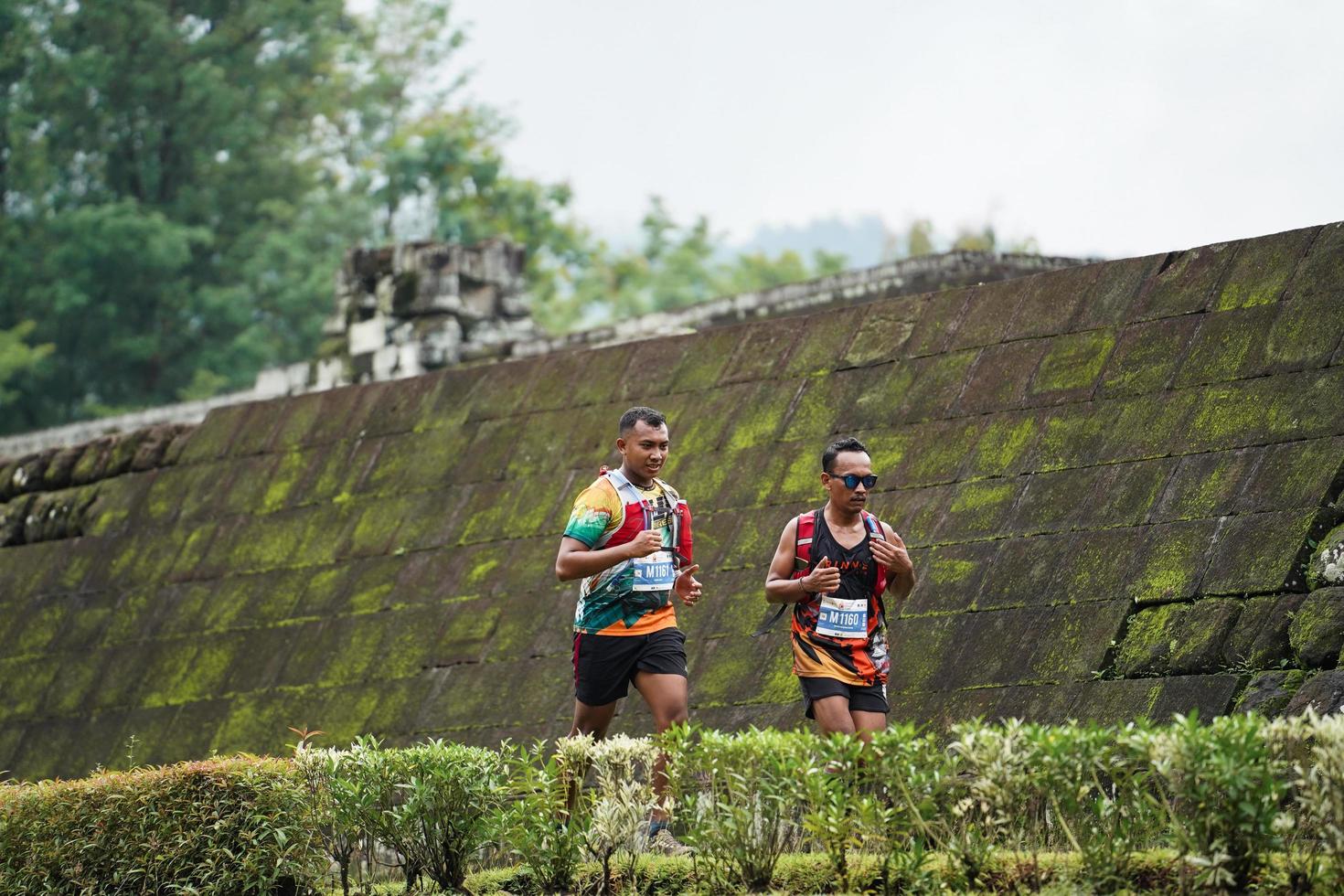 Yogyakarta, Indonesia - November 20, 2022 The Sleman Temple Run contingent passed the scenic route of the Barong temple, they took part in a trail running contest. photo