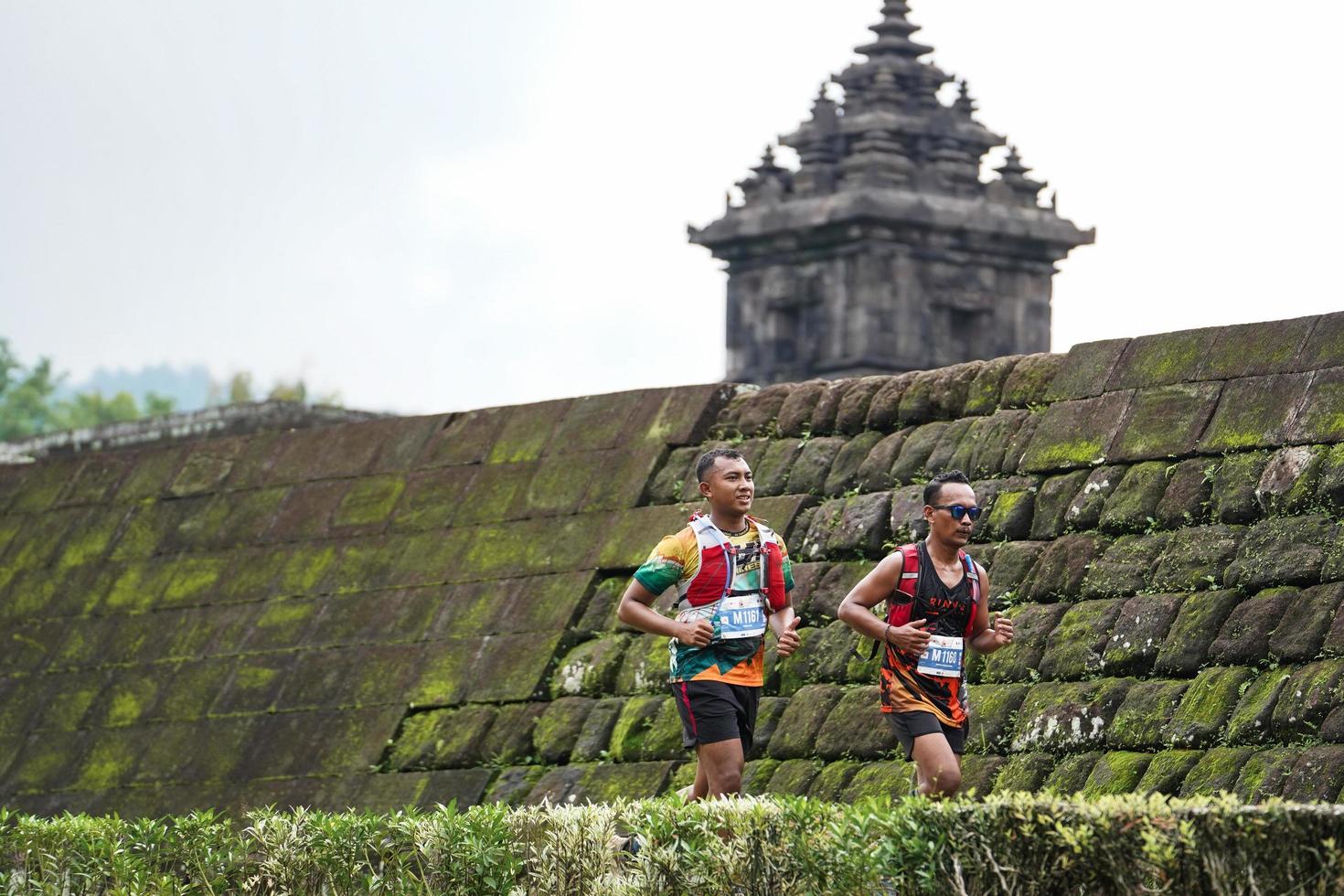Yogyakarta, Indonesia - November 20, 2022 The Sleman Temple Run contingent passed the scenic route of the Barong temple, they took part in a trail running contest. photo