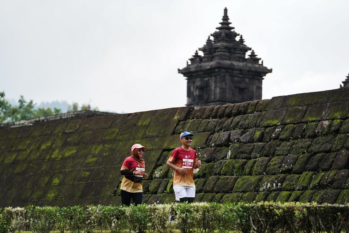 Yogyakarta, Indonesia - November 20, 2022 The Sleman Temple Run contingent passed the scenic route of the Barong temple, they took part in a trail running contest. photo