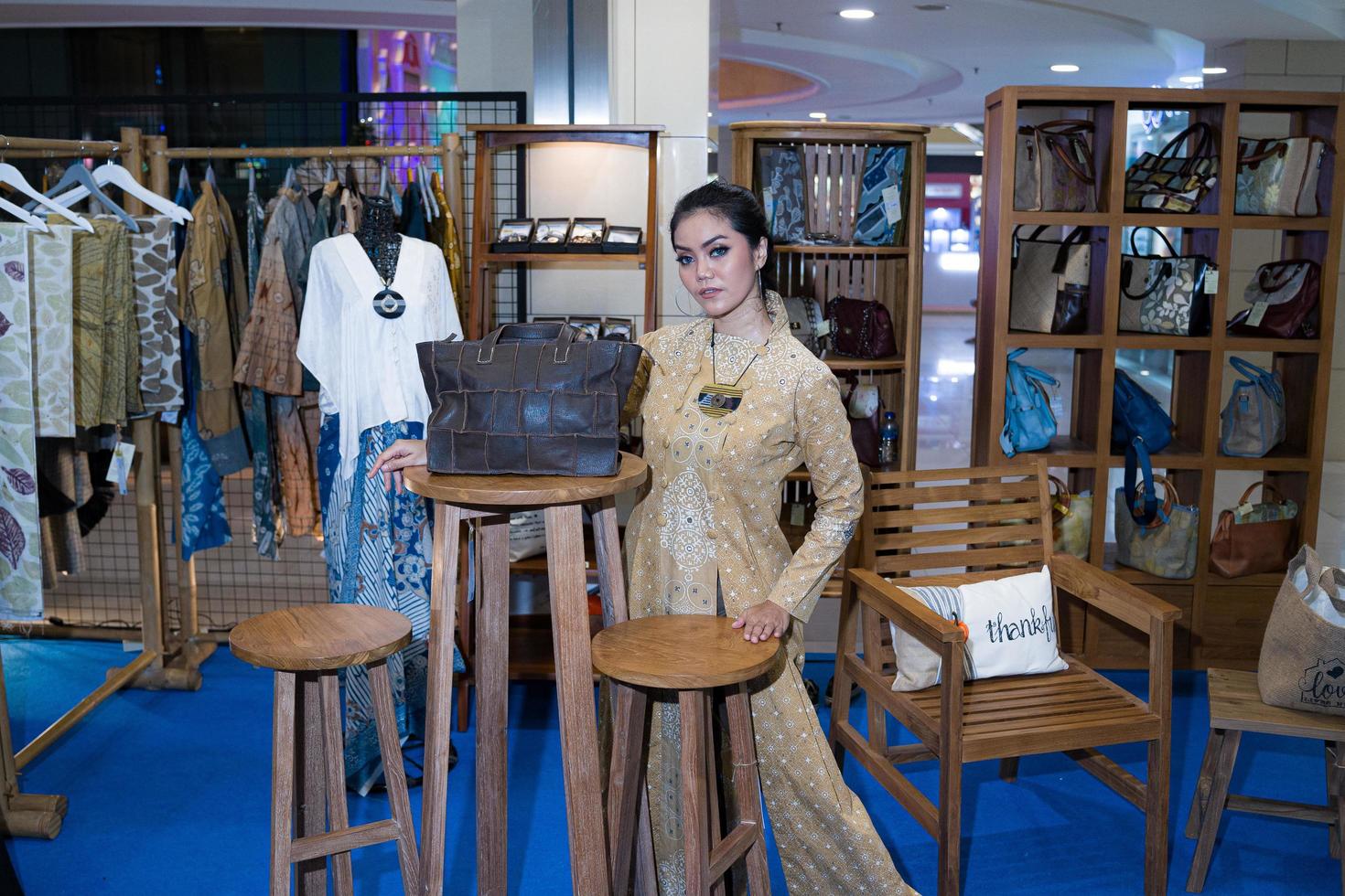 Yogyakarta, Indonesia - December 03, 2022  stylish female models among micro, small and medium enterprises, showing attractive clothes, accessories and properties. photo
