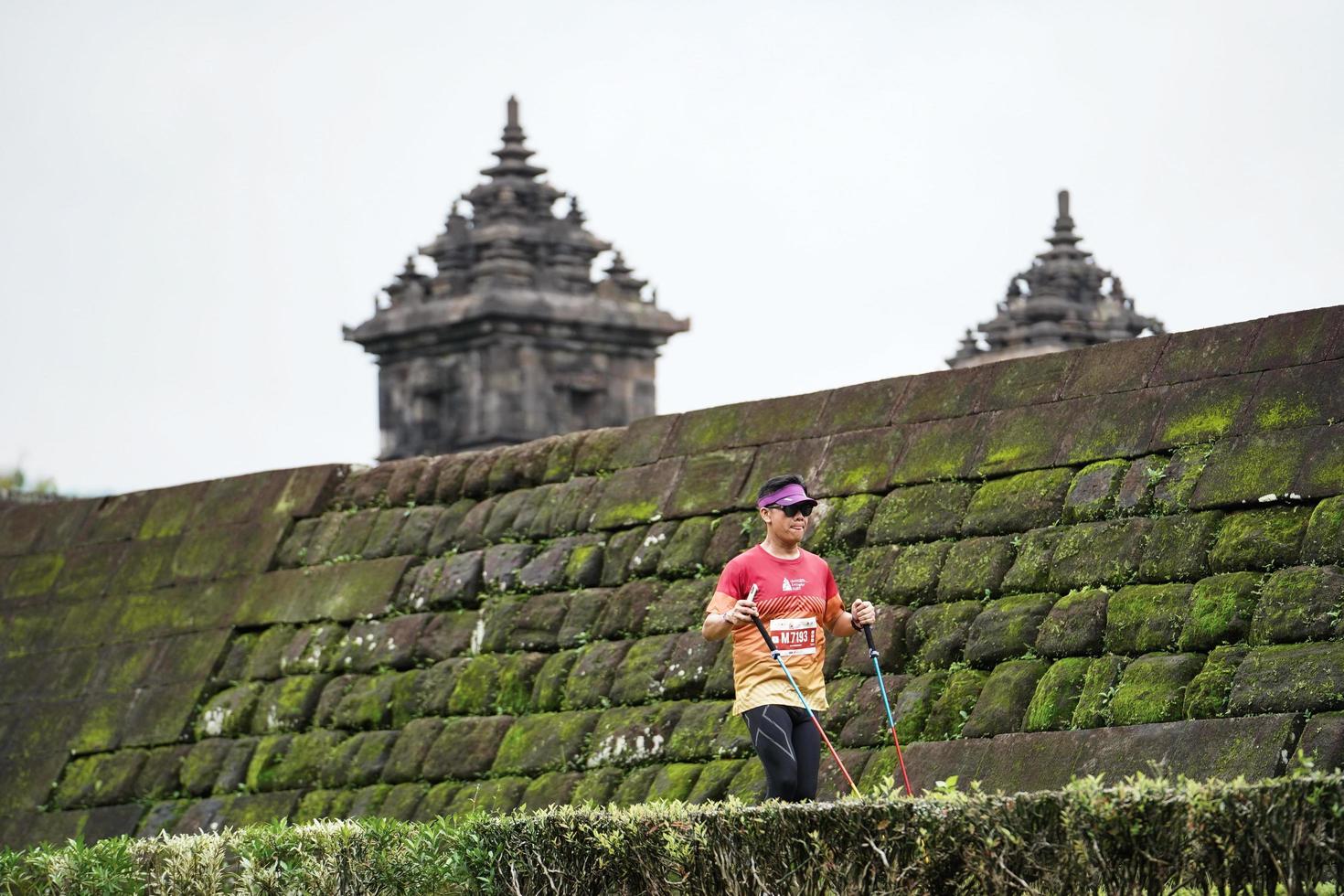 Yogyakarta, Indonesia - November 20, 2022 The Sleman Temple Run contingent passed the scenic route of the Barong temple, they took part in a trail running contest. photo