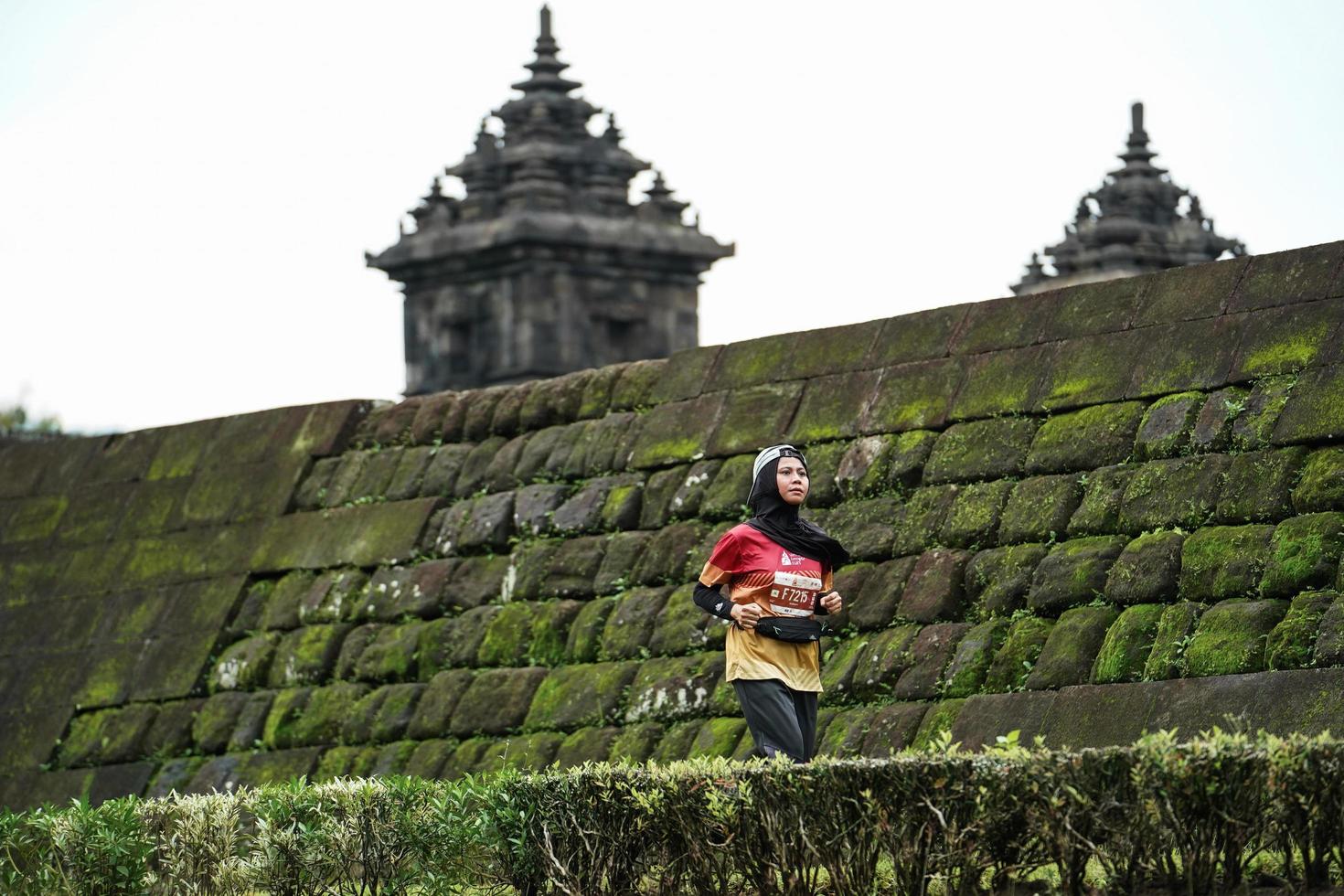 Yogyakarta, Indonesia - November 20, 2022 The Sleman Temple Run contingent passed the scenic route of the Barong temple, they took part in a trail running contest. photo