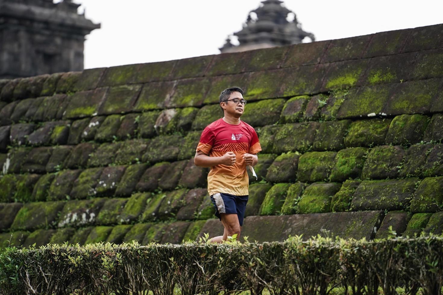 Yogyakarta, Indonesia - November 20, 2022 The Sleman Temple Run contingent passed the scenic route of the Barong temple, they took part in a trail running contest. photo