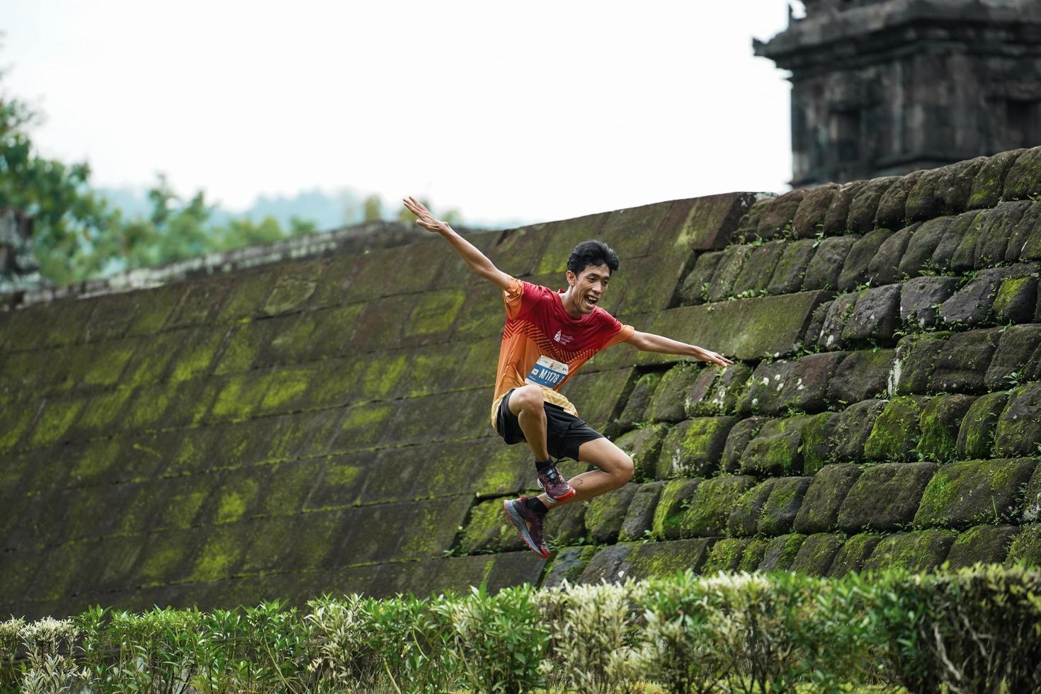 Yogyakarta, Indonesia - November 20, 2022 The Sleman Temple Run contingent passed the scenic route of the Barong temple, they took part in a trail running contest. photo