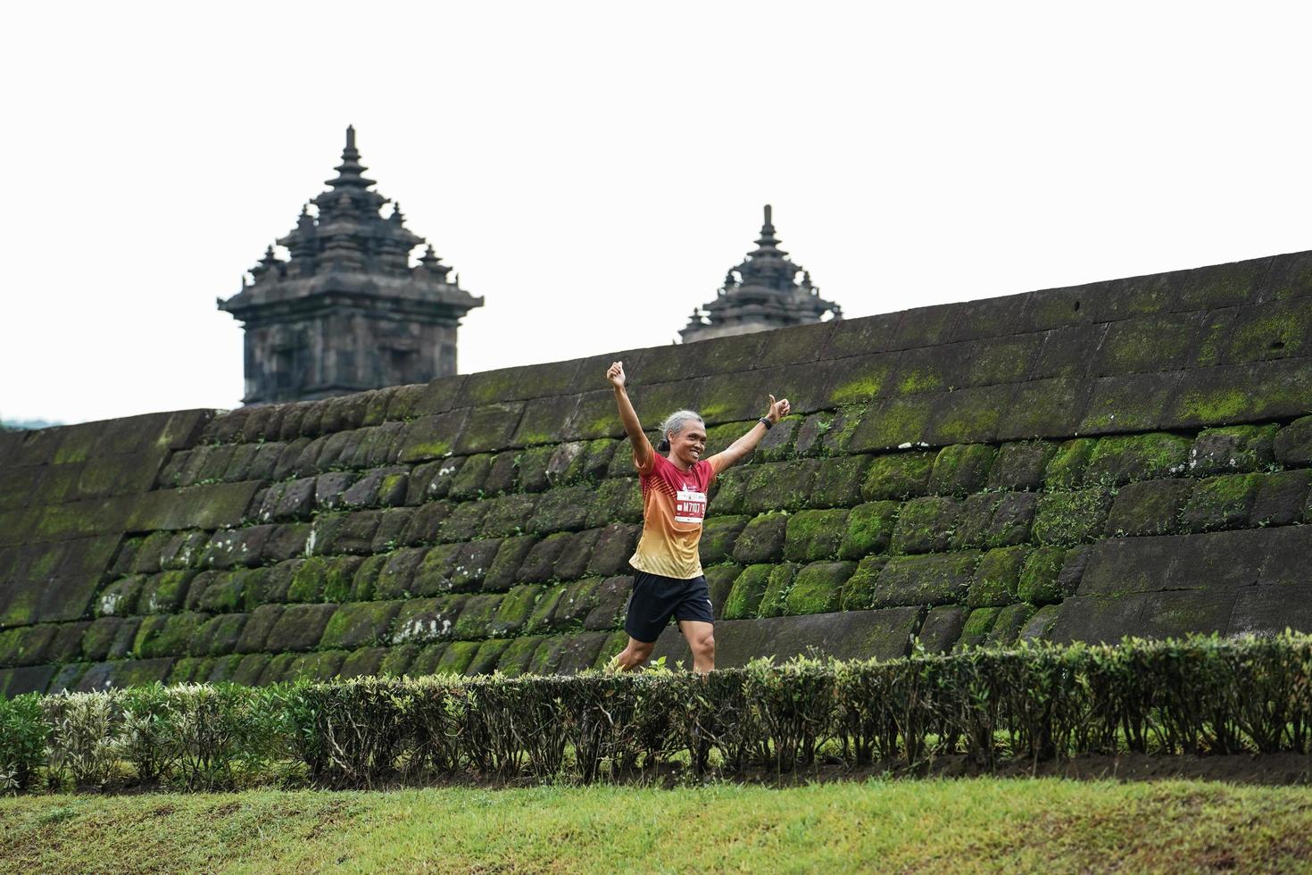 Yogyakarta, Indonesia - November 20, 2022 The Sleman Temple Run contingent passed the scenic route of the Barong temple, they took part in a trail running contest. photo