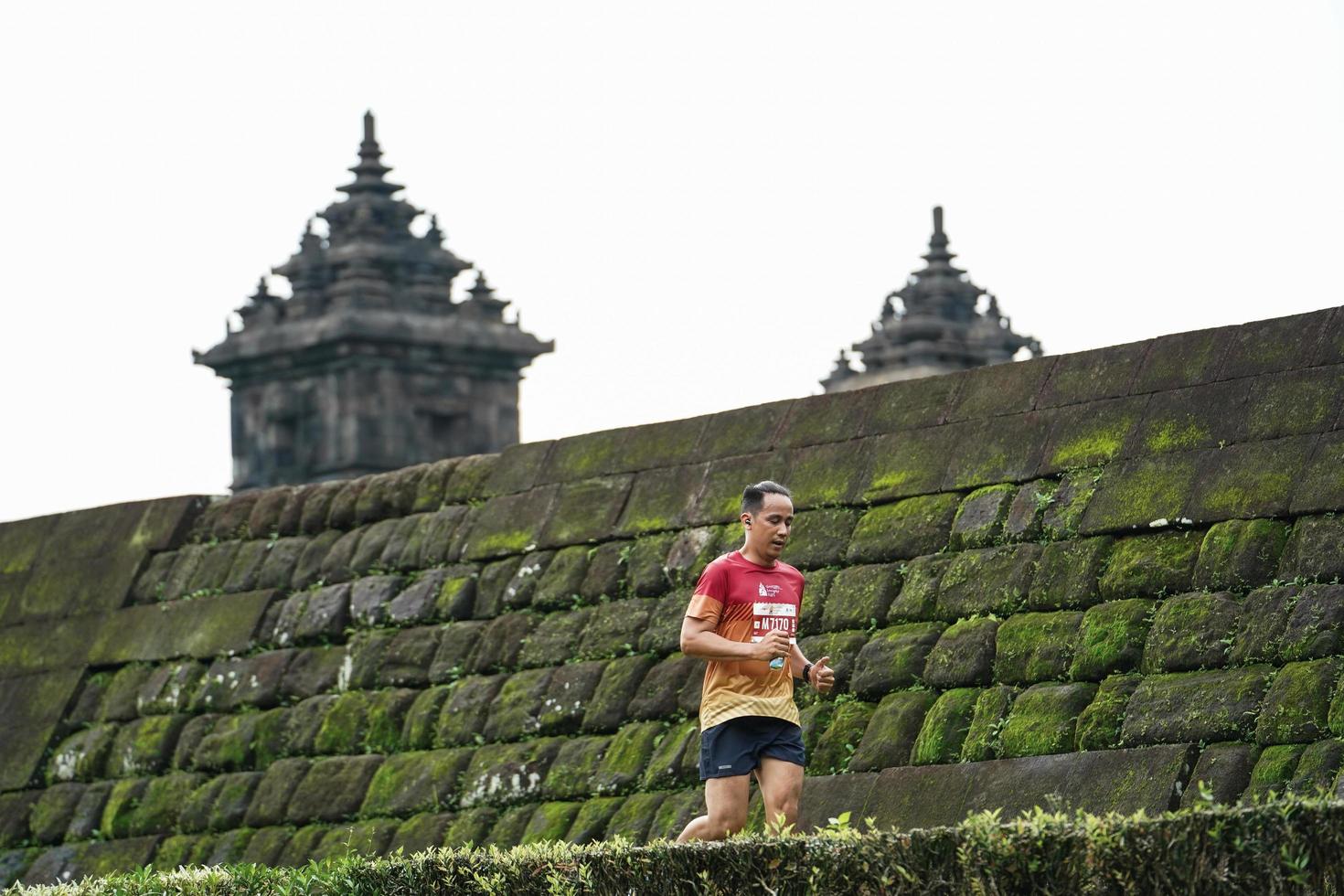 Yogyakarta, Indonesia - November 20, 2022 The Sleman Temple Run contingent passed the scenic route of the Barong temple, they took part in a trail running contest. photo